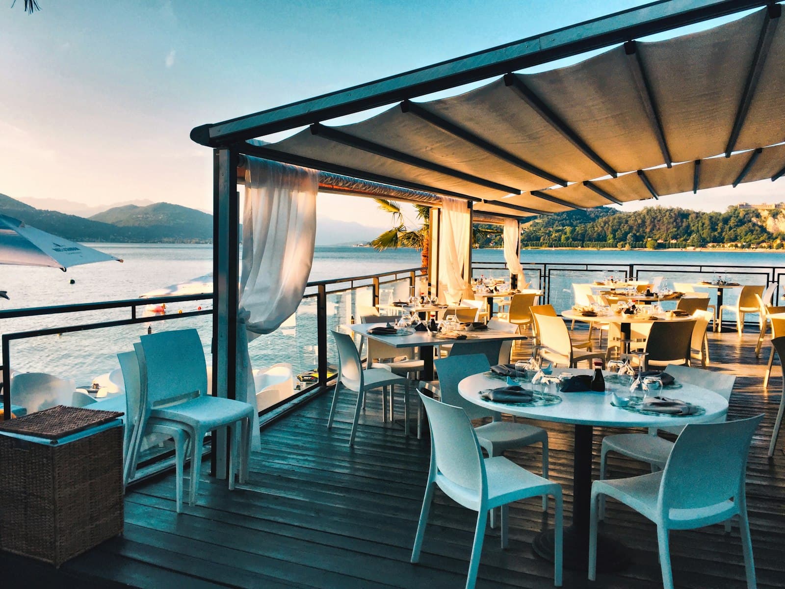An open-air dining terrace over the sea